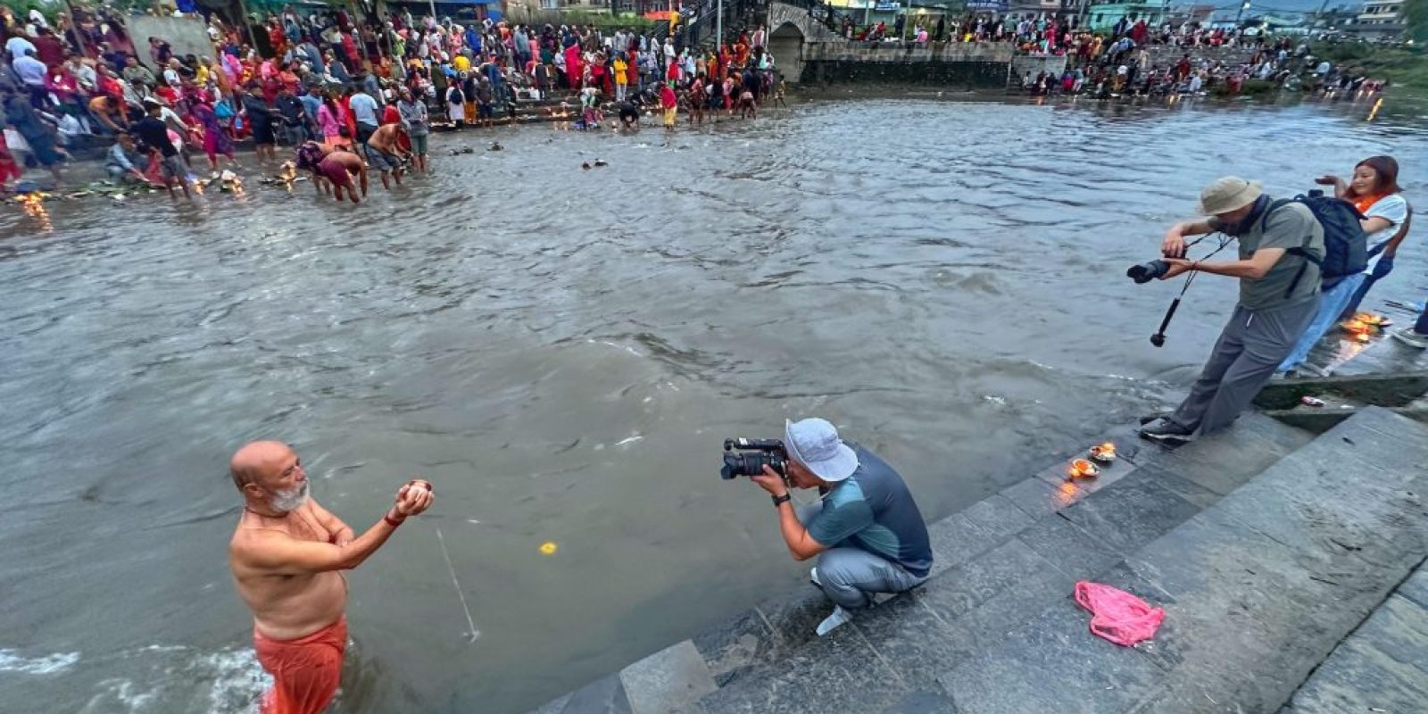 fatherday Chinese photographers take pictures on the bank of Bagmati river at Gokarneshwar temple in Kathmandu.